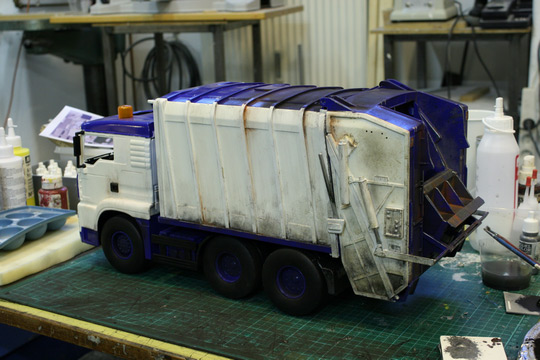Model garbage truck being painted